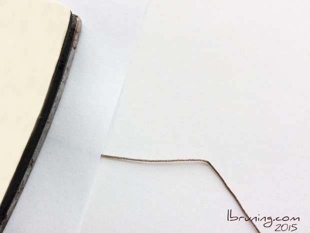 Iron Conductive THread Between Two Pieces of Paper